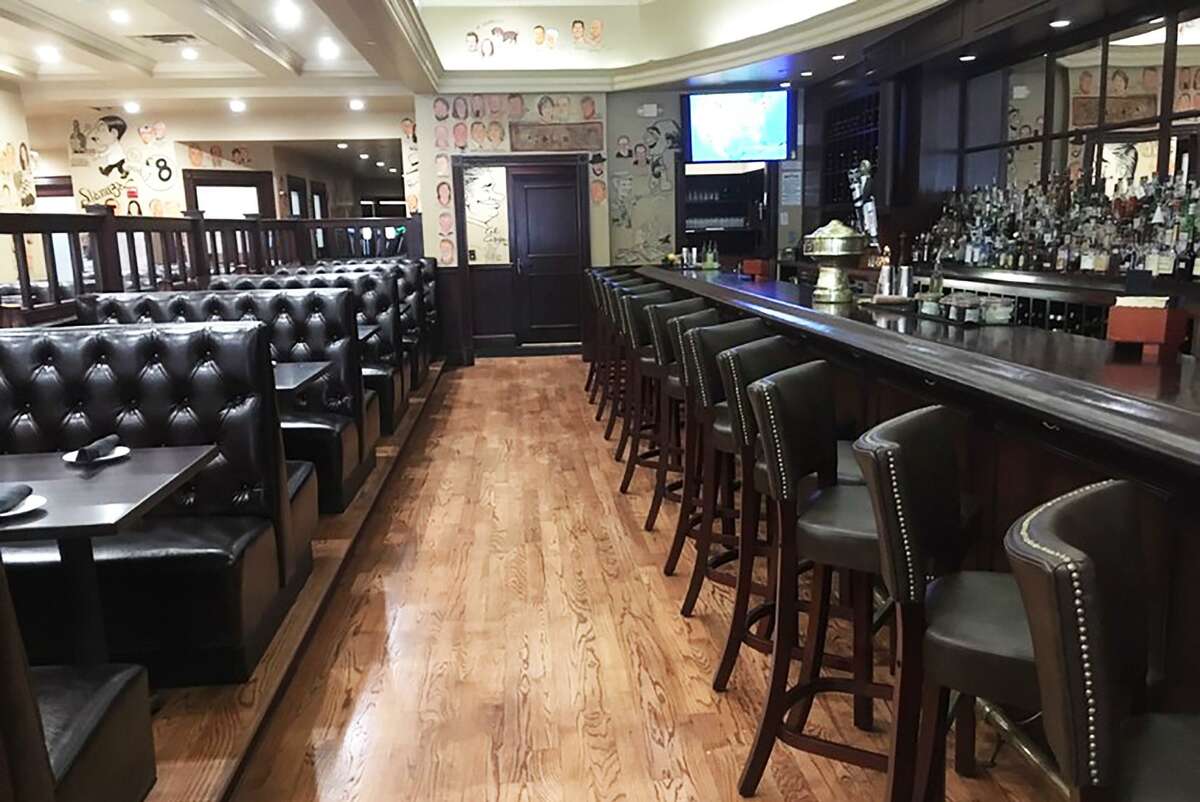 The renovated bar area at The Palm Restaurant in San Antonio features a widened aisle, brand new bar top and booths.