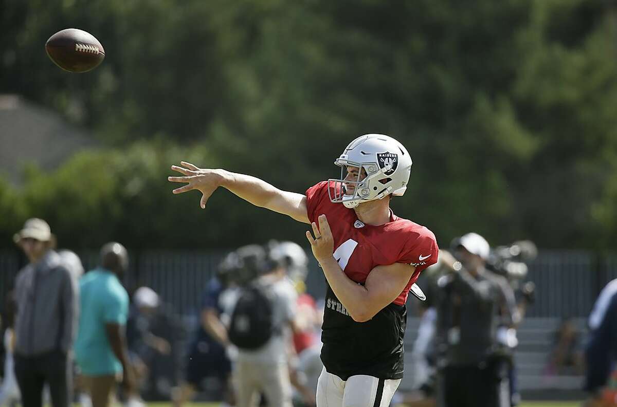 Oakland Raiders quarterback Derek Carr throws during NFL football training camp Wednesday, Aug. 7, 2019, in Napa, Calif. Both the Oakland Raiders and the Los Angeles Rams held a joint practice before their upcoming preseason game on Saturday. (AP Photo/Eric Risberg)