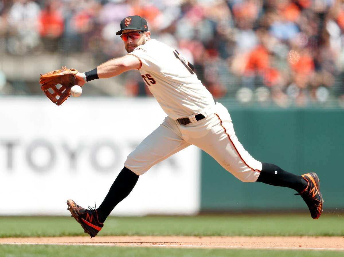 San Francisco Giants' Evan Longoria fields a grounder off the bat of Washington Nationals' Trea Turner in 4th inning during MLB game at Oracle Park in San Francisco, Calif., on Wednesday, August 7, 2019. Turner would beat Longoria's throw to first for an infield hit.