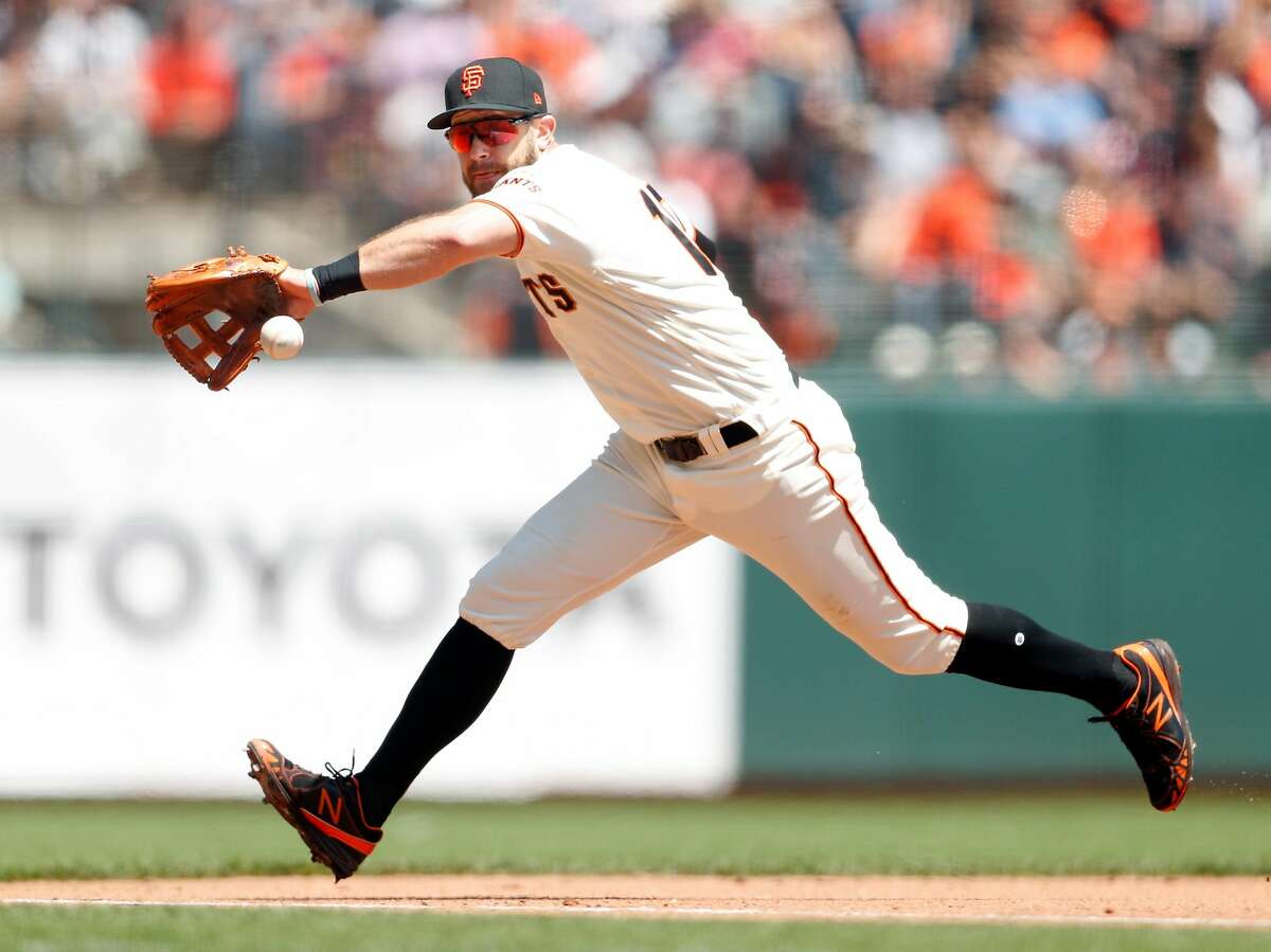 San Francisco Giants Evan Longoria makes a catch during practice