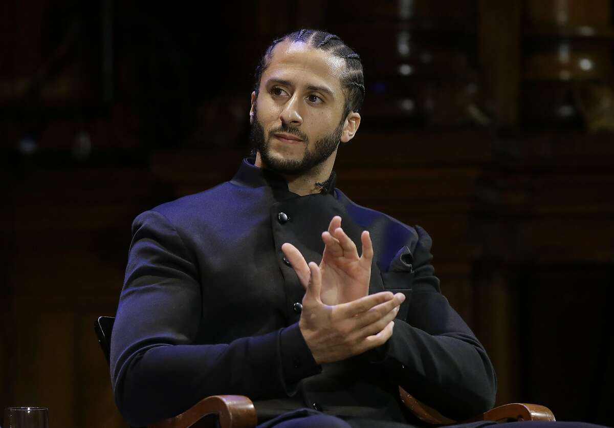 FILE - In this Oct. 11, 2018, file photo, former NFL football quarterback Colin Kaepernick applauds while seated on stage during W.E.B. Du Bois Medal ceremonies at Harvard University in Cambridge, Mass. Colin Kaepernick says he's "still ready" to return to the NFL, even though he is set to enter his third season out of the league. In a video posted Wednesday, Aug. 7, 2019 on social media, the 31-year-old Kaepernick is shown working out in a gym. He says in the video: "5 a.m. 5 days a week. For 3 years. Still Ready." (AP Photo/Steven Senne, File)