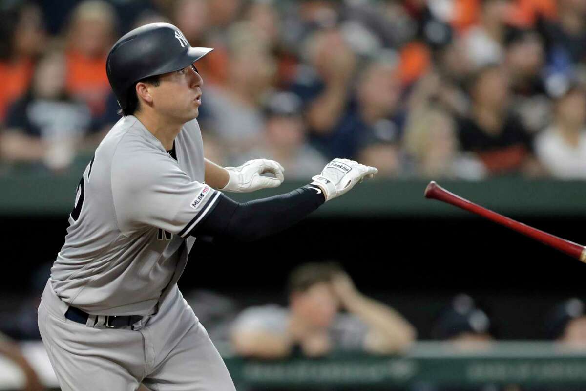 New York Yankees' Kyle Higashioka watches his three-run home run off Baltimore Orioles starting pitcher John Means during the fourth inning of a baseball game Wednesday, Aug. 7, 2019, in Baltimore. (AP Photo/Julio Cortez)