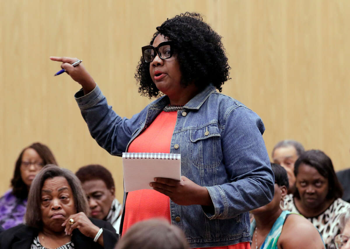Area resident Ruby Glass asks questions during a public meeting and panel discussion about the proposed concrete batch plant with various city and state agency representatives on Monday, Jul. 22, 2019 in Houston, TX.