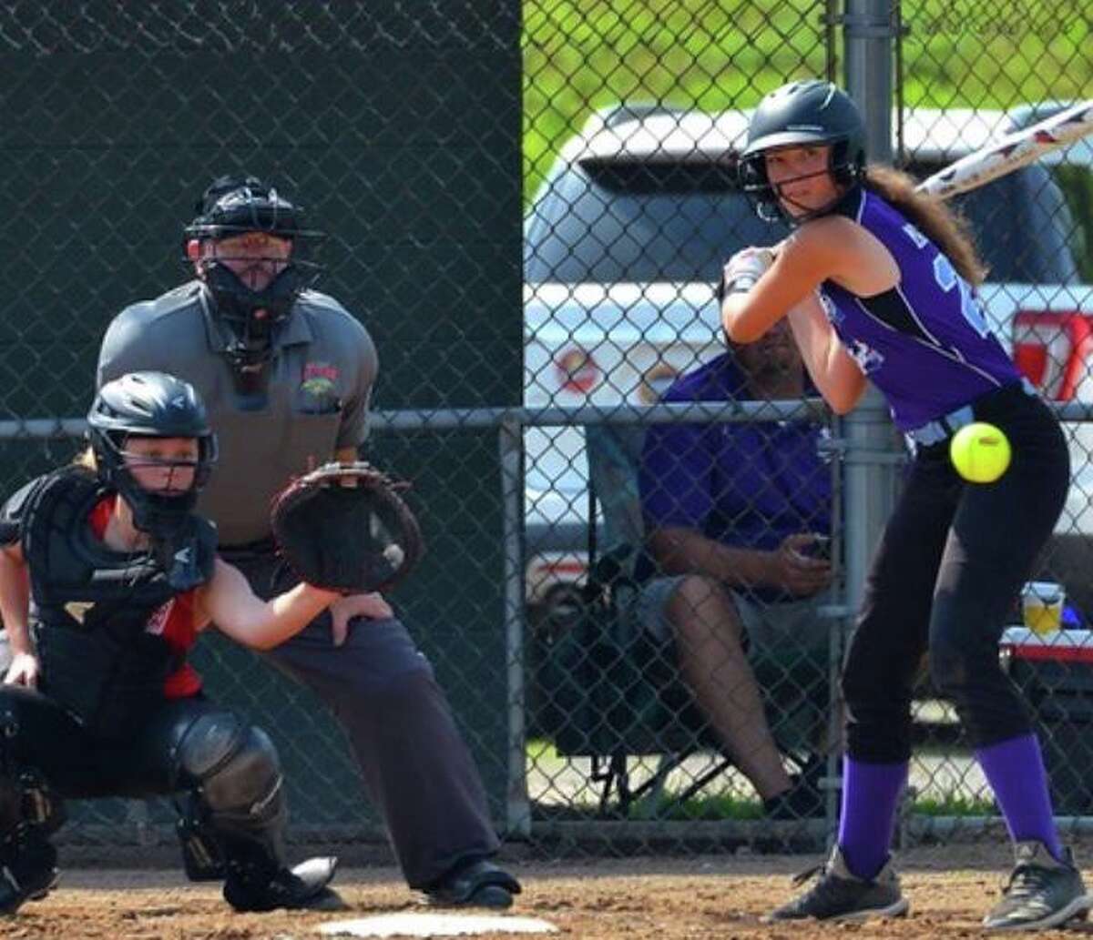 Bill Webster umpires the Junior League Softball Little League World Series in Kirkland, Wash.