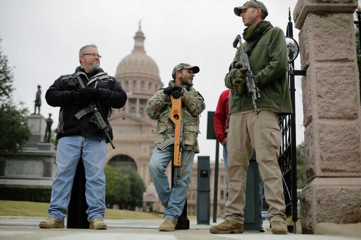 In this Jan. 13, 2015 file photo, gun rights advocates carry rifles while protesting outside the Texas Capitol in Austin, Texas. (AP Photo/Eric Gay, File)