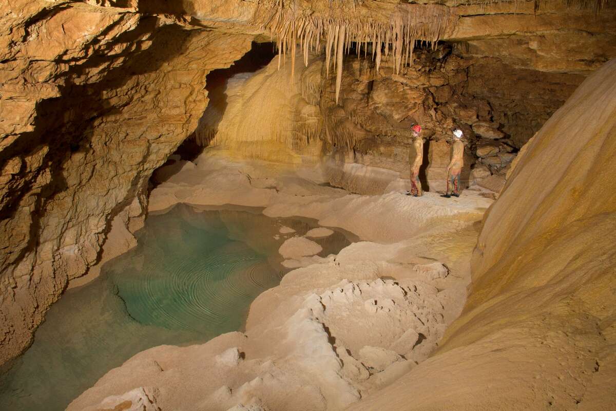 Brad and Travis alongside Mirror Lake inside Natural Bridge Caverns.