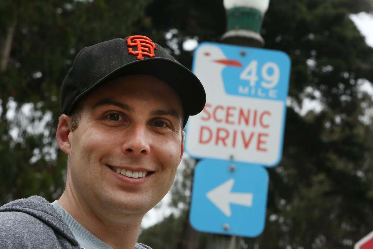 Eric Kingsbury stands for a portrait next to a 49 mile scenic drive sign on Monday, August 5, 2019 in San Francisco, Calif. Eric Kingsbury walked the entire 49 miles in one day in early July.