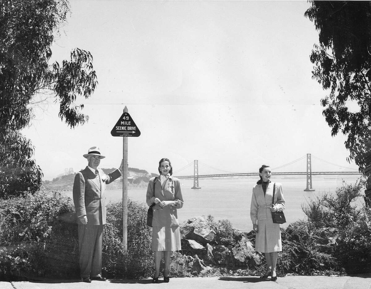 Aug. 15, 1947: Members of the Down Town Business Association debut the new 49-Mile Scenic Drive signs in 1947. The Drive was suspended during World War II.