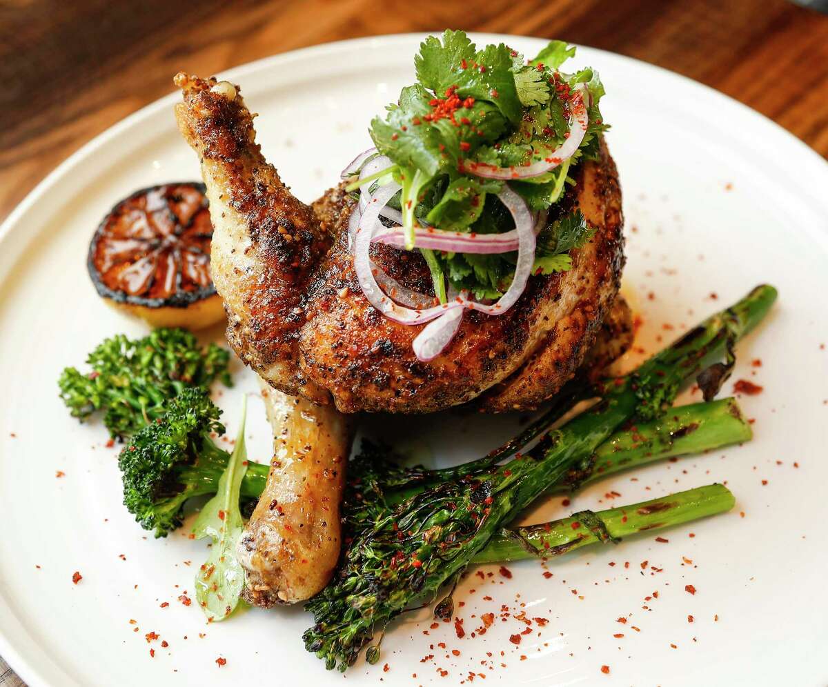 Za’atar Roasted Chicken served with grilled broccolini, cilantro salad and Aleppo pepper at Warehouse 72.