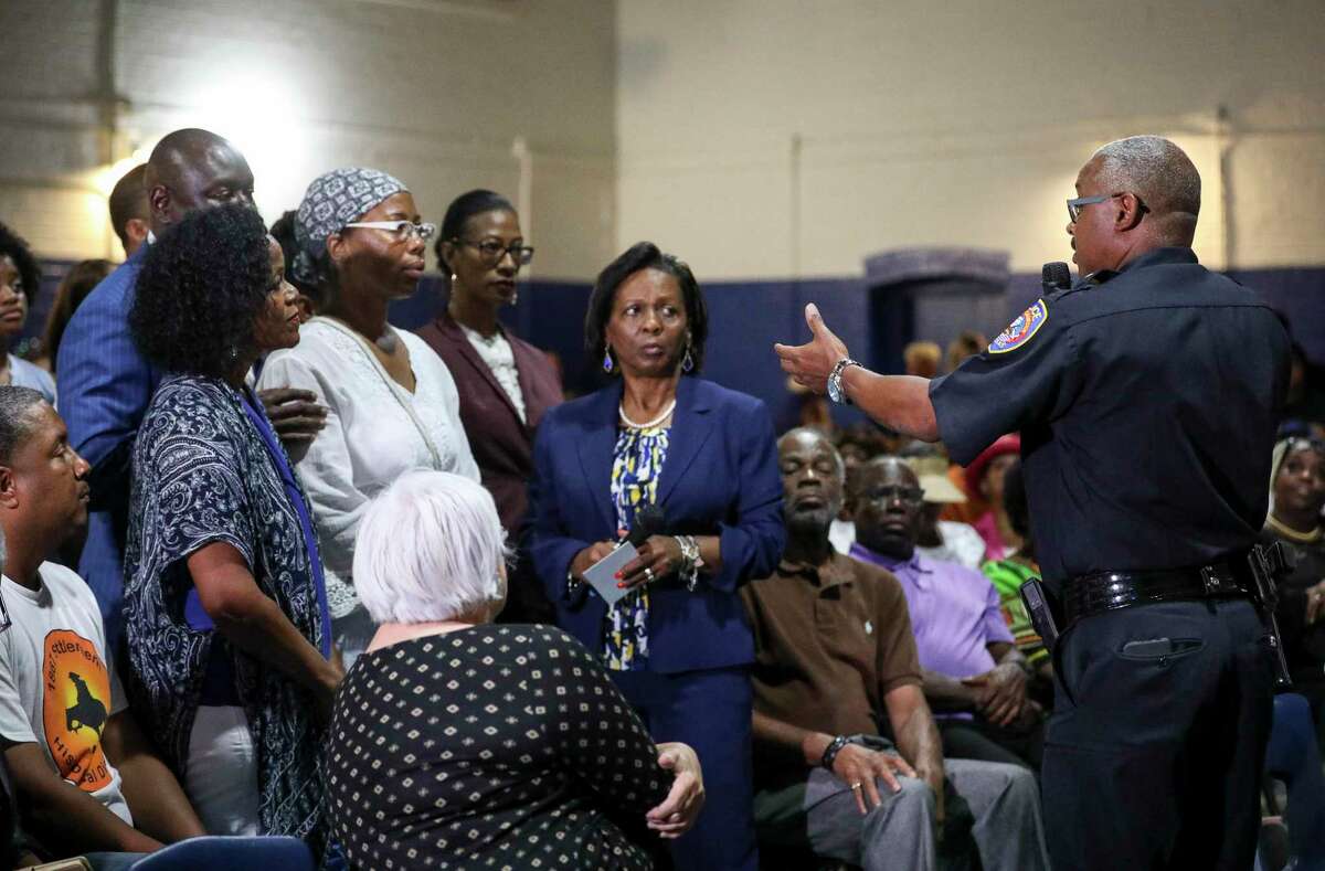 Galveston Police Chief Vernon Hale, right, speaks with family members of Donald Neely, their attorneys, and members of the public during a meeting about Neely's arrest, on Tuesday, Aug. 6, 2019, in Galveston. During the arrest, horse-mounted officers used what appeared to be a rope to lead Neely down the street.