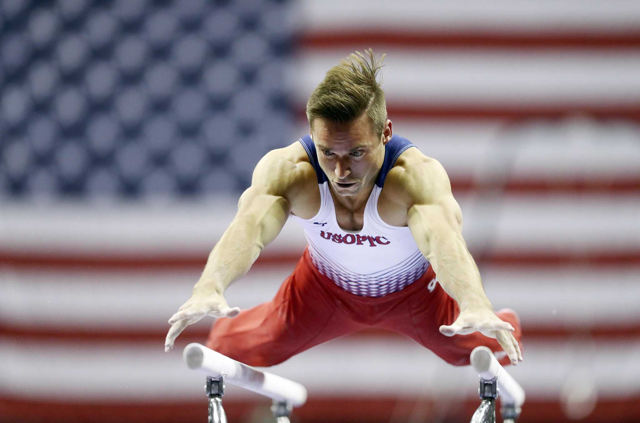 Sam Mikulak surges to lead at USA Gymnastics championships.