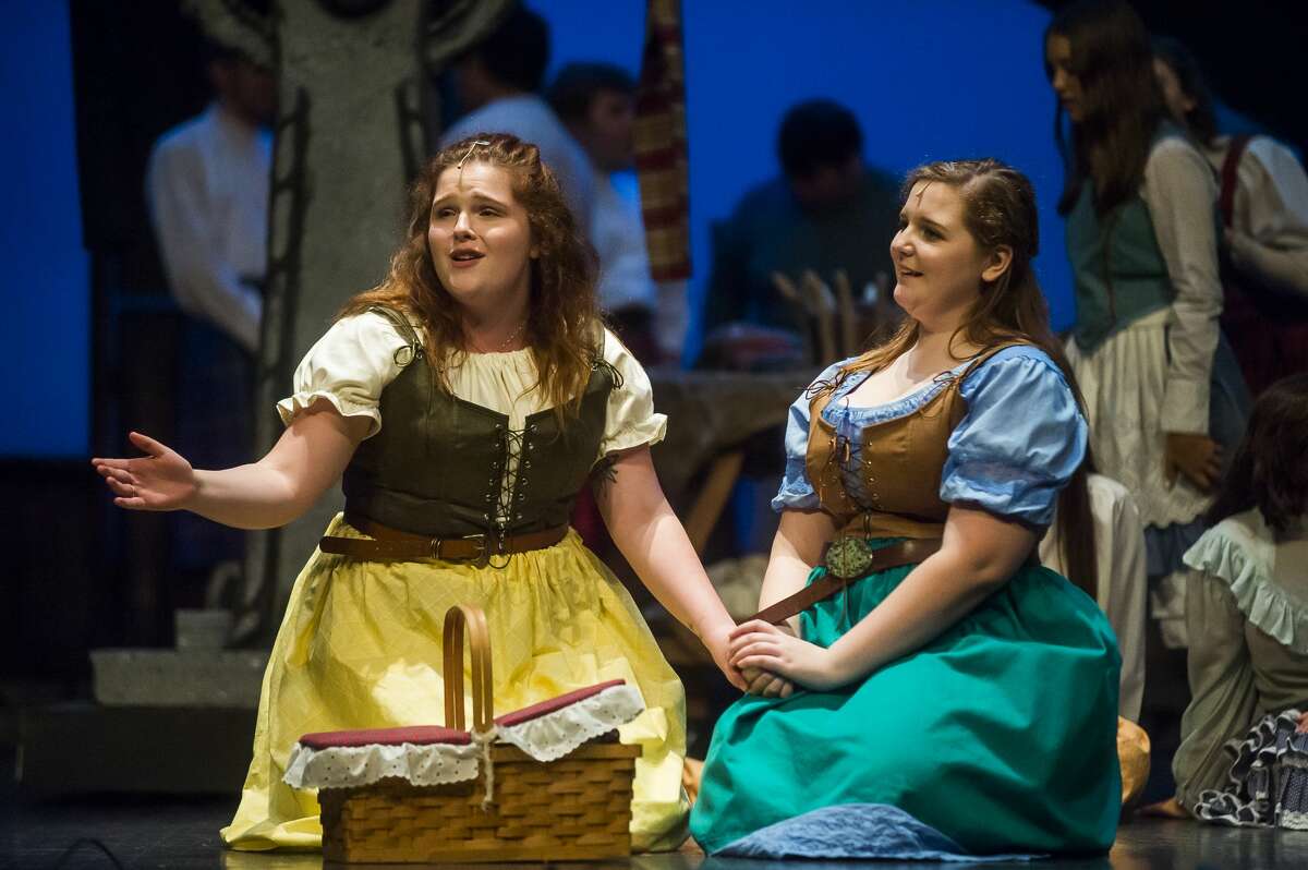 Ella McKane-Wright in the role of Fiona MacLaren, left, and Kennedy Danner in the role of Meg Brockie, right, act out a scene during a dress rehearsal for Teenage Musicals Inc.'s production of "Brigadoon" on Thursday, Aug. 8, 2019 at the Midland Center for the Arts. (Katy Kildee/kkildee@mdn.net)