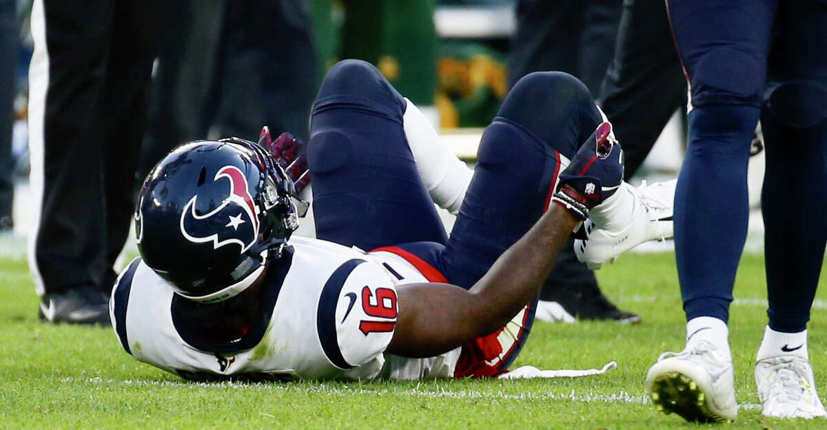 Houston Texans wide receiver Keke Coutee lies on the turf after suffering an injury during a preseason NFL football game against the Green Bay Packers from the bench at Lambeau Field in Thursday, Aug. 8, 2019, in Green Bay, Wis.