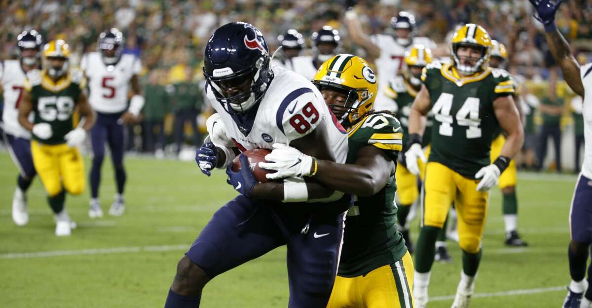 Houston Texans tight end Jerell Adams (89) hauls in a touchdown reception during the second half of a preseason NFL football game against the Green Bay Packers from the bench at Lambeau Field in Thursday, Aug. 8, 2019, in Green Bay, Wis.