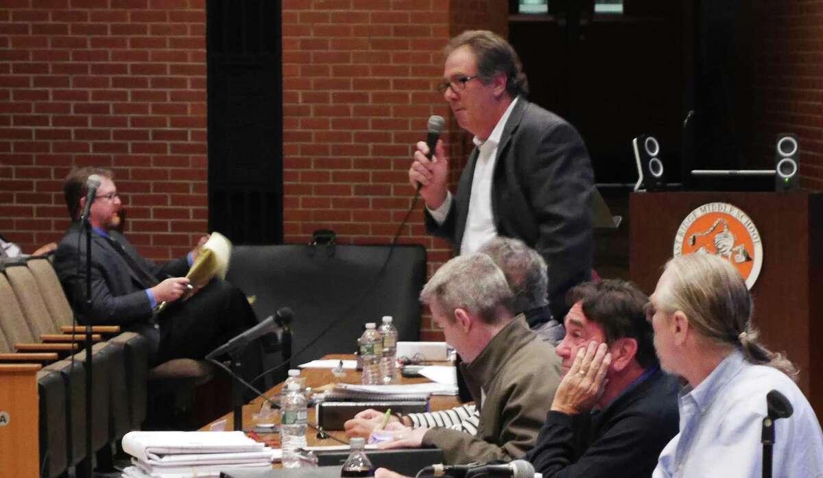 Zoning commissioner Joe Fossi speaks at a recent public hearing.