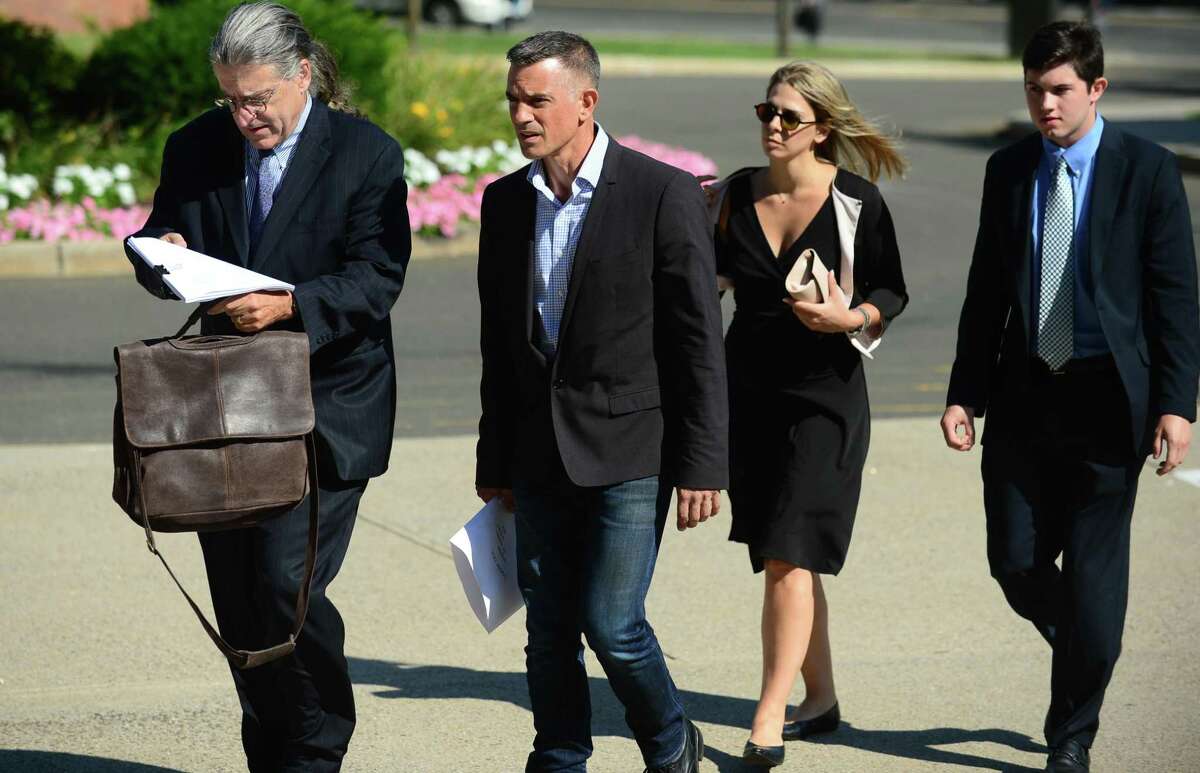 Fotis Dulos enters the Stamford courthouse Friday morning with his attorneys.
