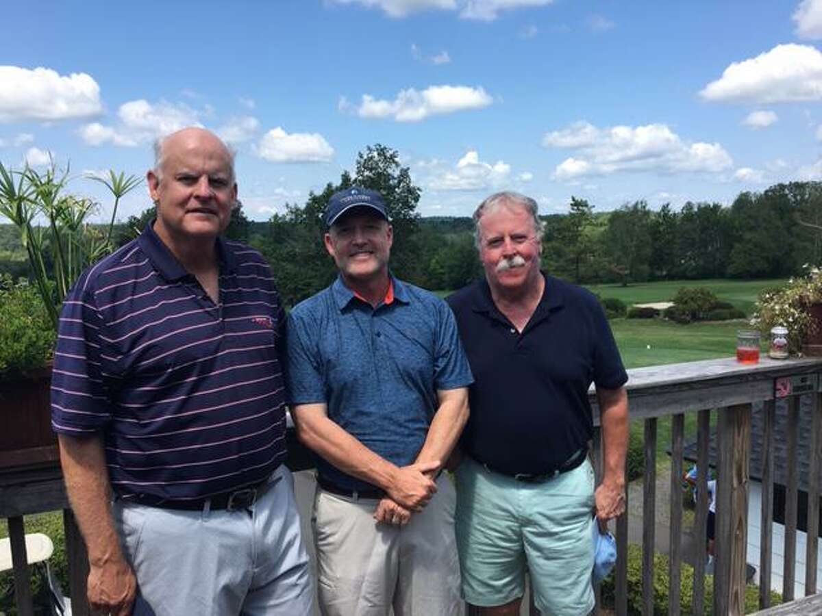 Anders Johncke (center) is the new club champion of the Ridgefield Men’s Golf Club. Flanking Johncke are club president Joe Moorhead (left) and tournament chairman Mike Reilly.