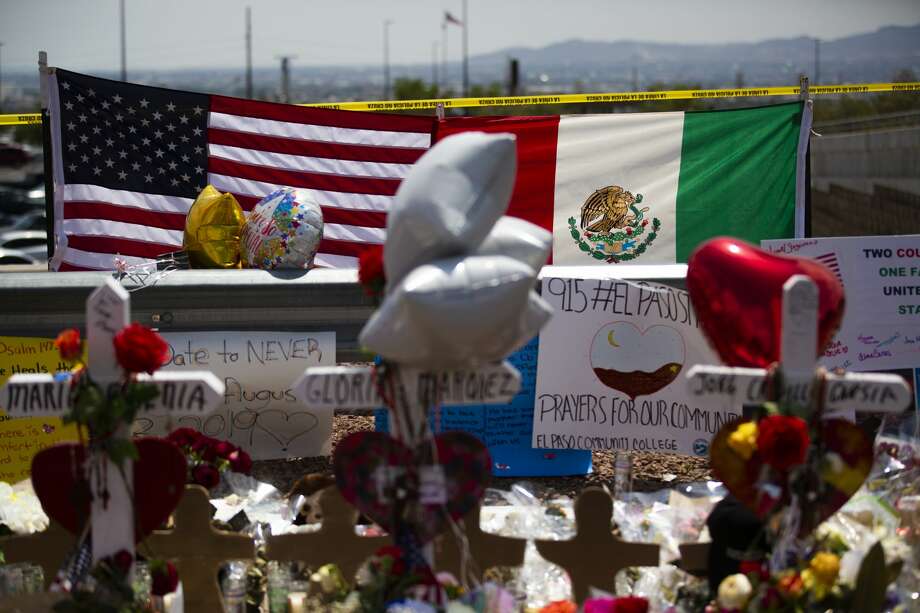 The United States flag and the Mexican flag are placed next to each other at the makeshift memorial that honors the victims of the El Paso shooting. Photo: Marie D. De Jesús/Staff Photographer
