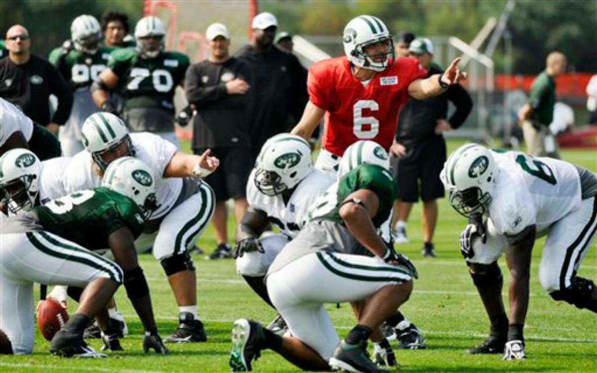New York Jets quarterback Mark Sanchez (6) directs the offense during morning practice at the team's NFL football training camp in Cortland, N.Y., Tuesday, Aug. 3, 2010. (AP Photo/Kevin Rivoli)