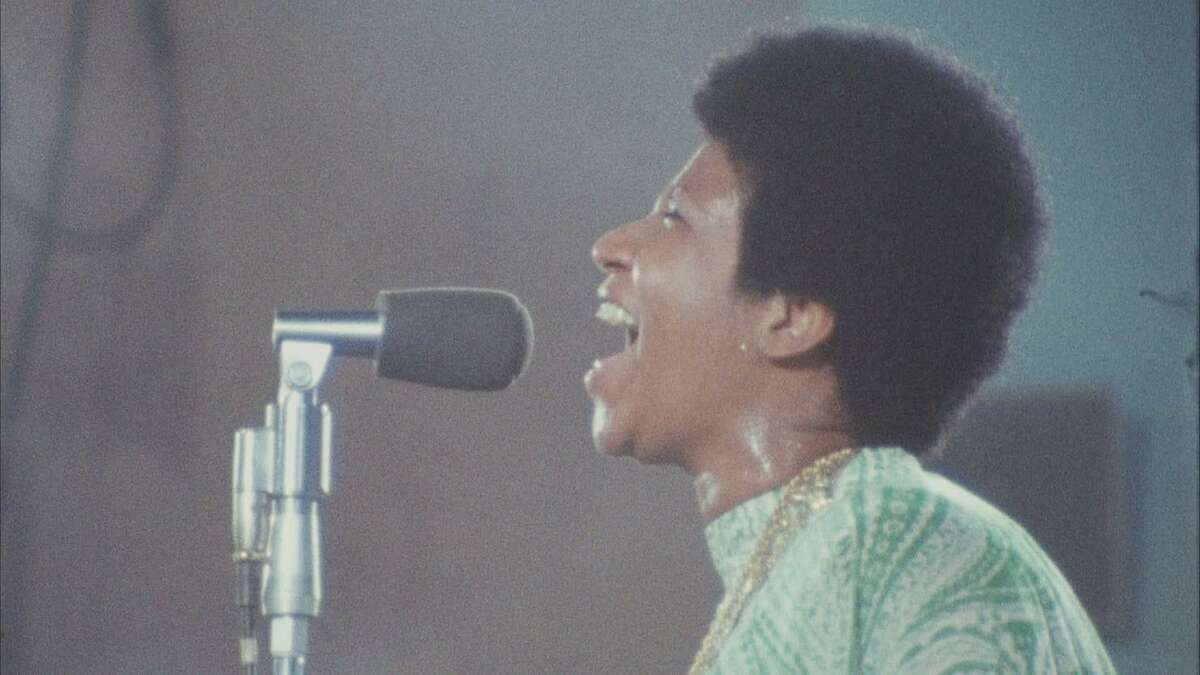 Aretha Franklin in a scene from the film, “Amazing Grace.” Witnessing Franklin, choir and congregation in the midst of a profound spiritual experience encourages something similar in the viewer.