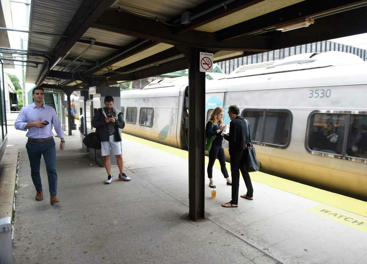 Commuters wait on the platform at the Greenwich Train Station in downtown Greenwich, Conn. Tuesday, July 23, 2019. The town is working with The Ashforth Company and Beyer Blinder Belle architects in a $45 million project to completely redevelop the central train station.