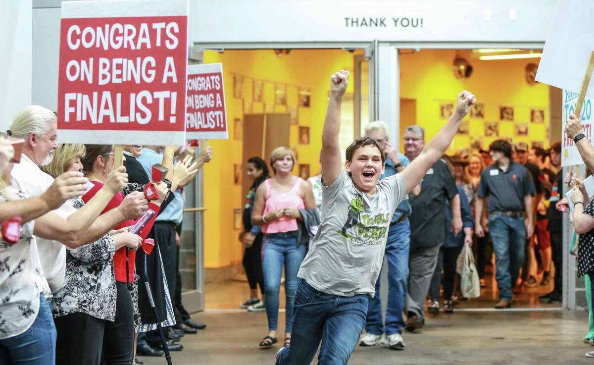 Luke Johannson,14, explodes in joy that 3 Sons Foods LLC won grand prize at the H-E-B Quest for Texas Best statewide food competition on Thursday, Aug. 8, at the Houston Food Bank. Luke, his mother and two brothers founded the sauce company together because they wanted to step up their efforts raise funds for rhino conservation.