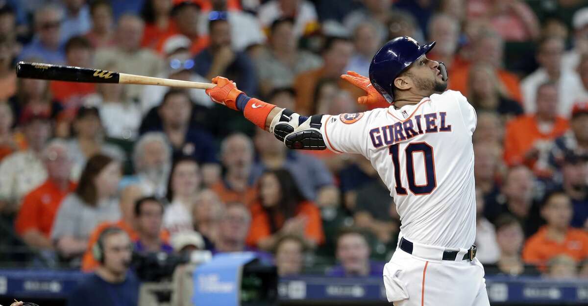 Houston Astros first baseman Yuli Gurriel (10) watches his RBI hit during a baseball game against the Colorado Rockies Wednesday, August 7, 2019, in Houston. (AP Photo/Michael Wyke)