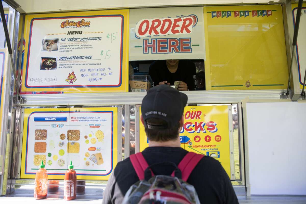 A customer orders at Senor Sisig at the 2019 Outside Lands in Golden Gate Park in San Francisco, Calif. on August 9, 2019.