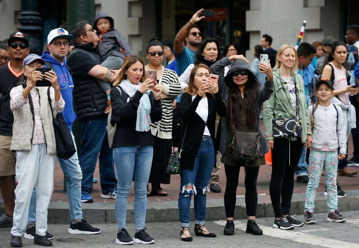 Spectators watch the the Pistahan parade turn onto Fourth Street from Market Street on its way to the annual festival celebrating Filipino culture at Yerba Buena Gardens in San Francisco, Calif. on Saturday, Aug. 10, 2019.