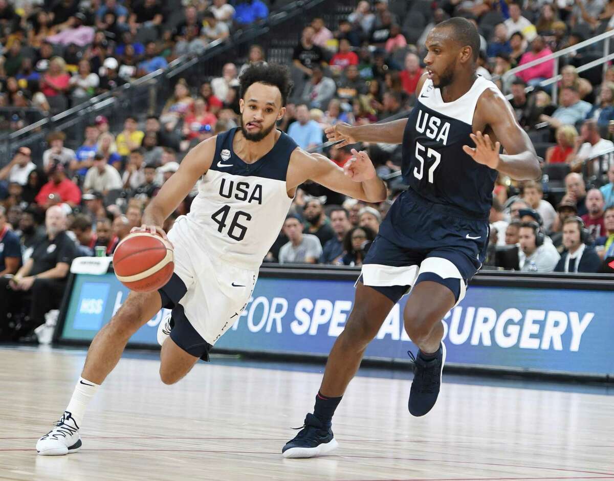 LAS VEGAS, NEVADA - AUGUST 09: Derrick White #46 of the 2019 USA Men's Select Team drives against Khris Middleton #57 of the 2019 USA Men's National Team during the 2019 USA Basketball Men's National Team Blue-White exhibition game at T-Mobile Arena on August 9, 2019 in Las Vegas, Nevada. (Photo by Ethan Miller/Getty Images)
