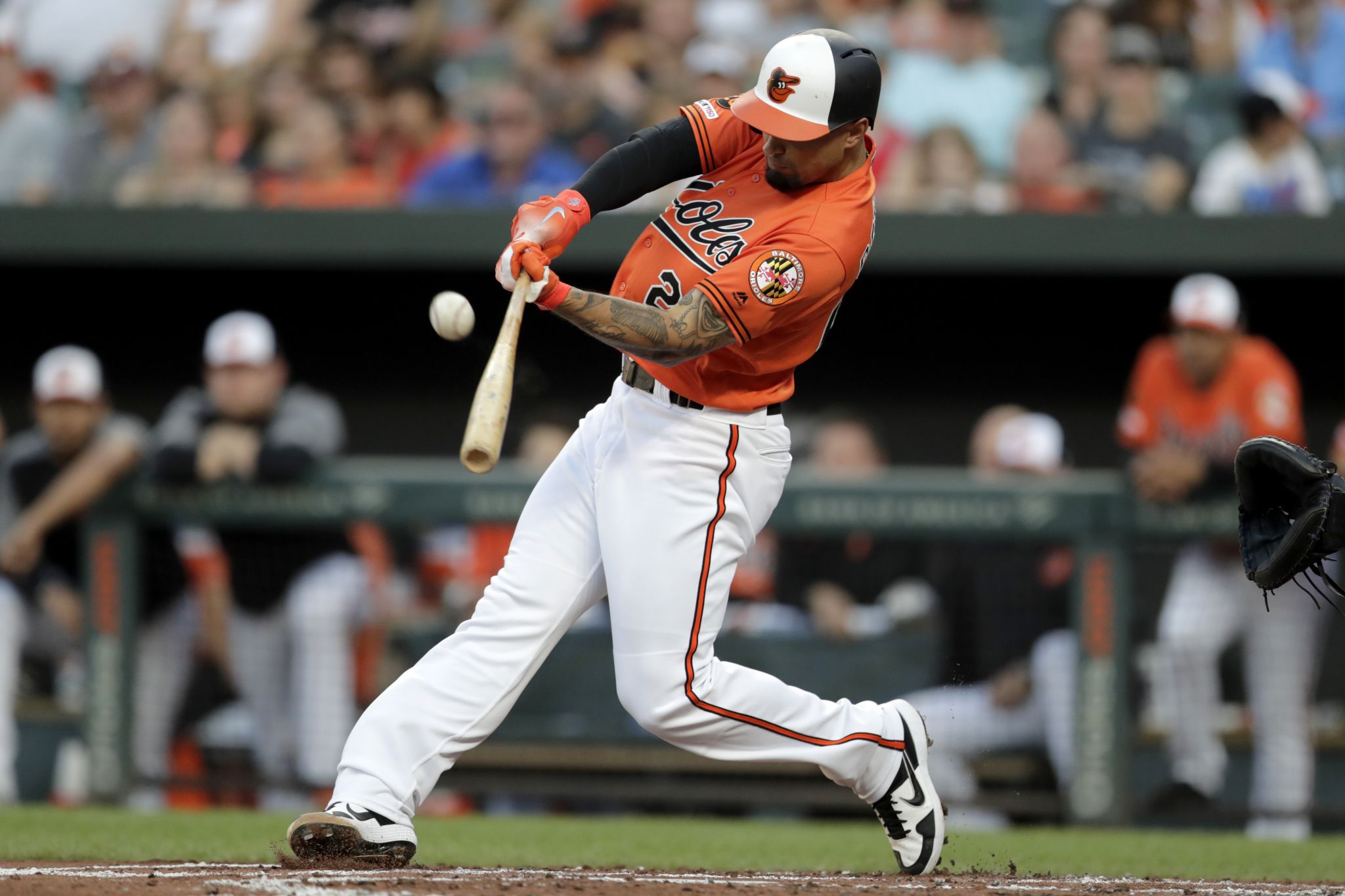 Baltimore Orioles' Renato Nunez, left, is greeted near home plate