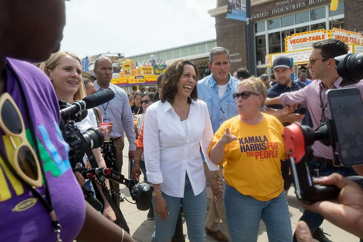 Democratic presidential candidate Sen. Kamala Harris walks with Sue Dvorsky at the Iowa State Fair in Des Moines on Saturday, Aug. 10, 2019.