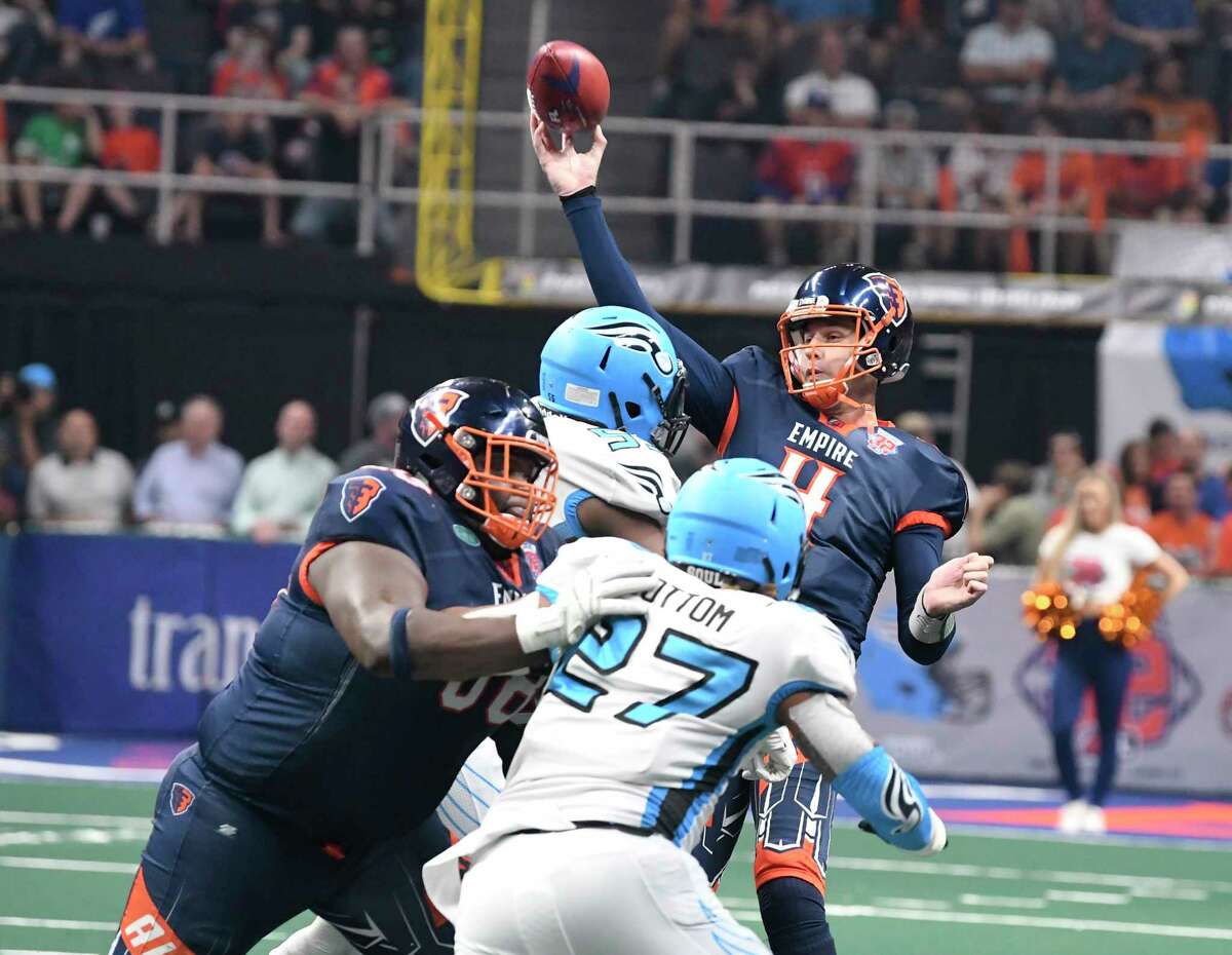 Albany Empire's Tommy Grady (4) throws under pressure by the Philadelphia Souls during the second half of the ArenaBowl XXXII football game at the Times Union Center, Sunday, Aug. 11, 2019, in Albany, N.Y. Albany Empire won 45-27. Grady is returning to the Empire, who are playing in the National Arena League. (Hans Pennink / Special to the Times Union)