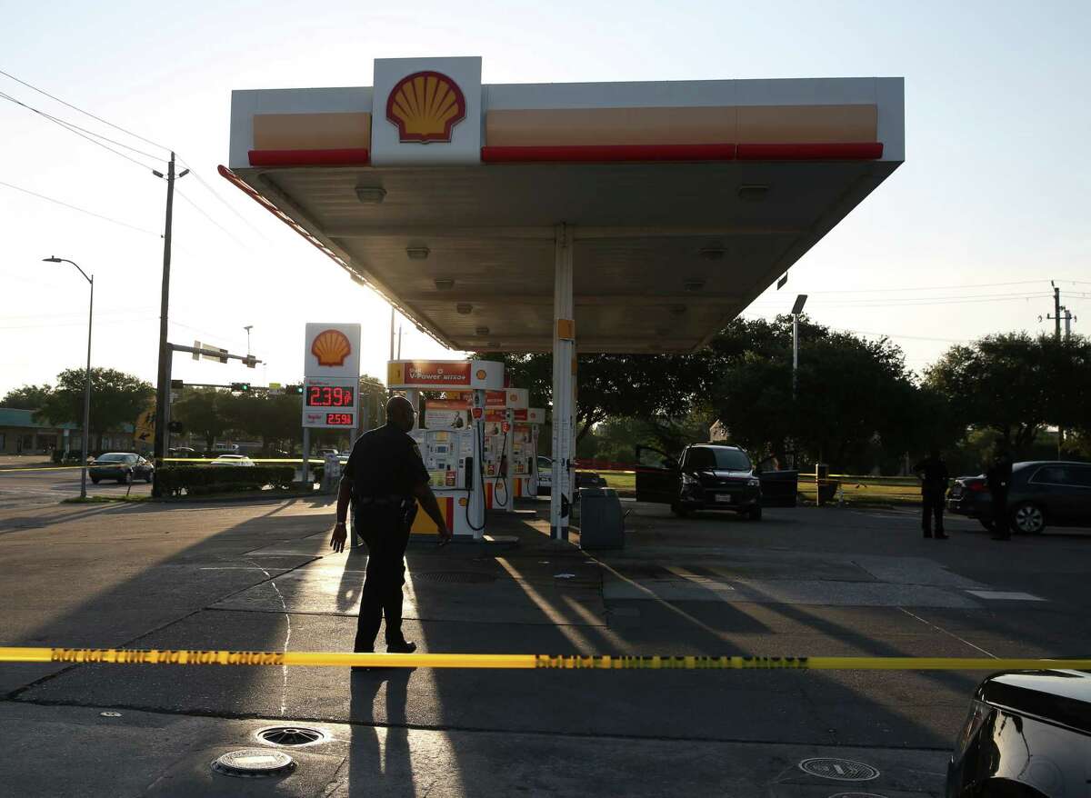 HPD officers respond to 7100 block of West Fuqua Street, where two people were shot and one person deceased at a gas station, on Monday, Aug. 12, in Houston.