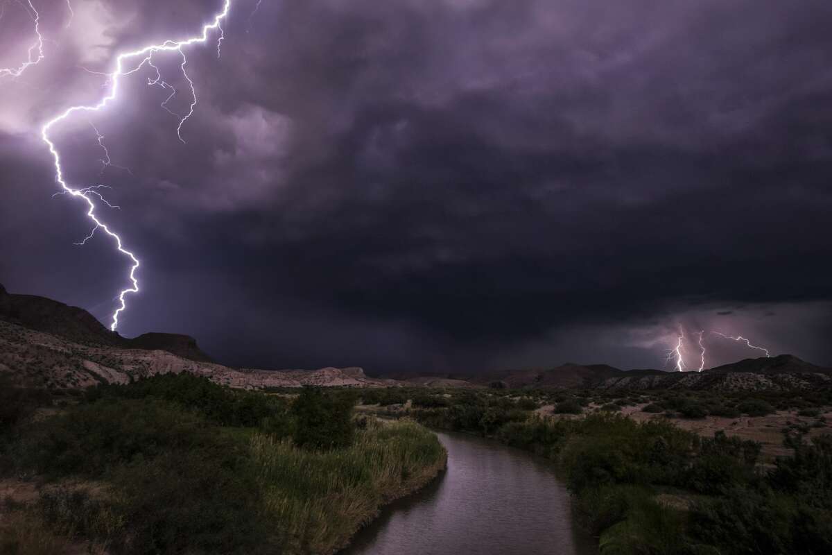 Lightning is seen on either side of the United State-Mexico border on June 24, 2017.