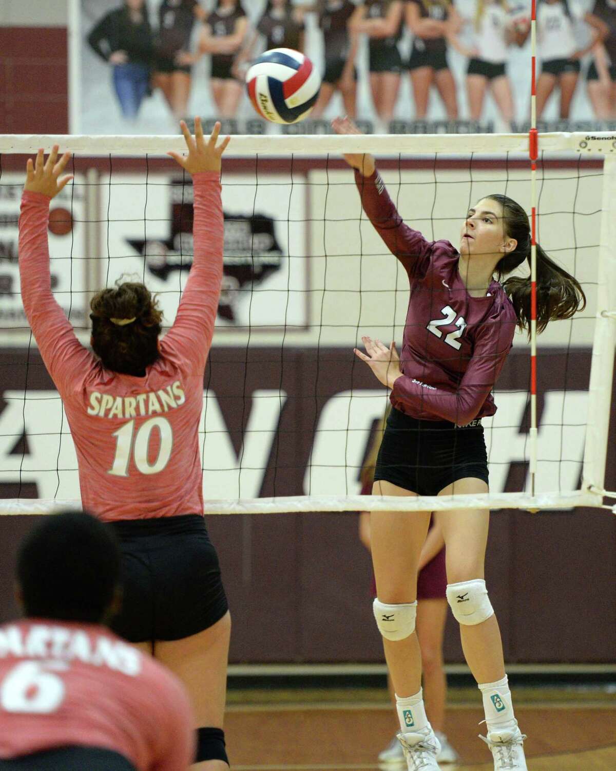 Camryn Griffin (22) of Cinco Ranch attempts a kill shot during the first set of a volleyball match between the Cinco Ranch Cougars and the Cy Lakes Spartans on Friday, August 9, 2019 at Cinco Ranch HS, Katy, TX.