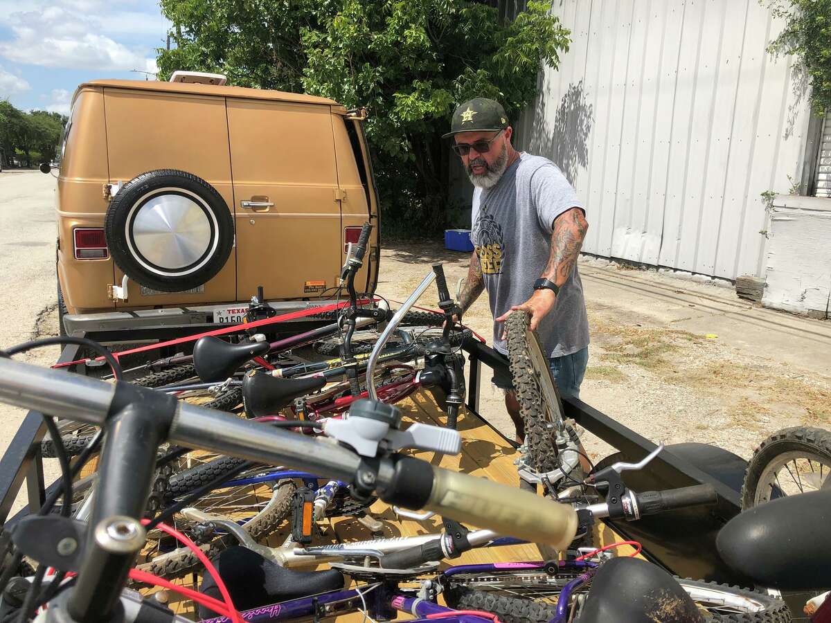Ferrell Surette with a load of his bicycles from his company, Recycled Cycles of Texas, to give away to struggling families and the homeless.