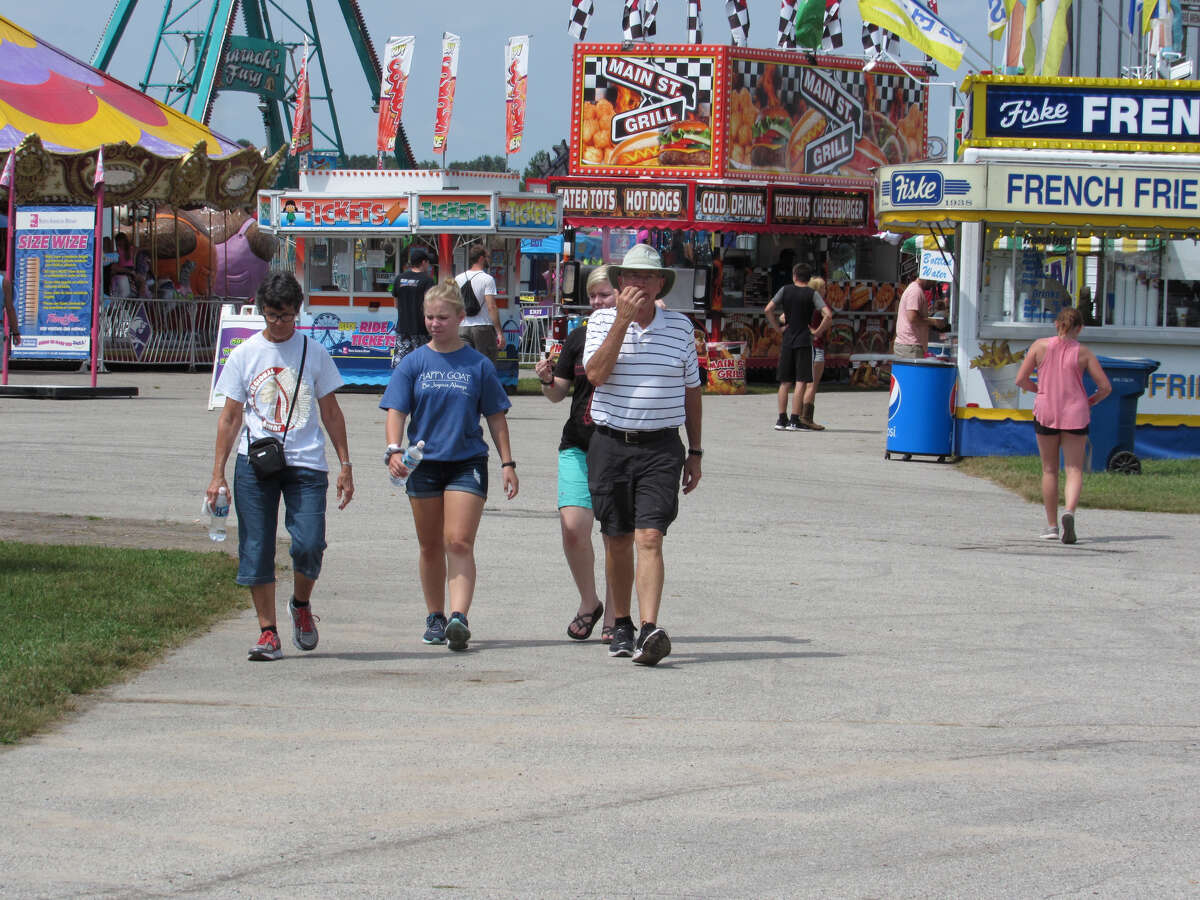 Midland residents flock to the Midland County Fair on Monday to enjoy rides, attractions, food and more on Aug. 12, 2019. (Mitchell Kukulka/Mitchell.Kukulka@mdn.net).