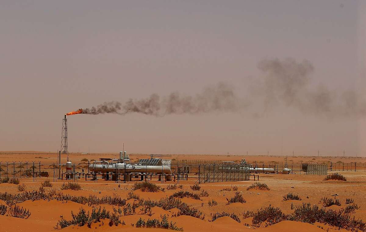 (FILES) In this file photo taken on June 23, 2008, a flame from a Saudi Aramco oil installion known as "Pump 3" is seen in the desert near the oil-rich area of Khurais, 160 kms east of the Saudi capital Riyadh.