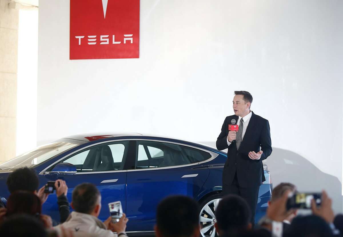 BEIJING, CHINA - OCTOBER 23: (CHINA OUT) Elon Musk, Chairman, CEO and Product Architect of Tesla Motors, addresses a press conference to declare that the Tesla Motors releases v7.0 System in China on a limited basis for its Model S, which will enable self-driving features such as Autosteer for a select group of beta testers on October 23, 2015 in Beijing, China. The v7.0 system includes Autosteer, a new Autopilot feature. While it's not absolutely self-driving and the driver still need to hold the steering wheel and be mindful of road conditions and surrounding traffic when using Autosteer. When set to the new Autosteer mode, graphics on the driver's display will show the path the Model S is following, post the current speed limit and indicate if a car is in front of the Tesla. (VCG via Getty Images/TNS)
