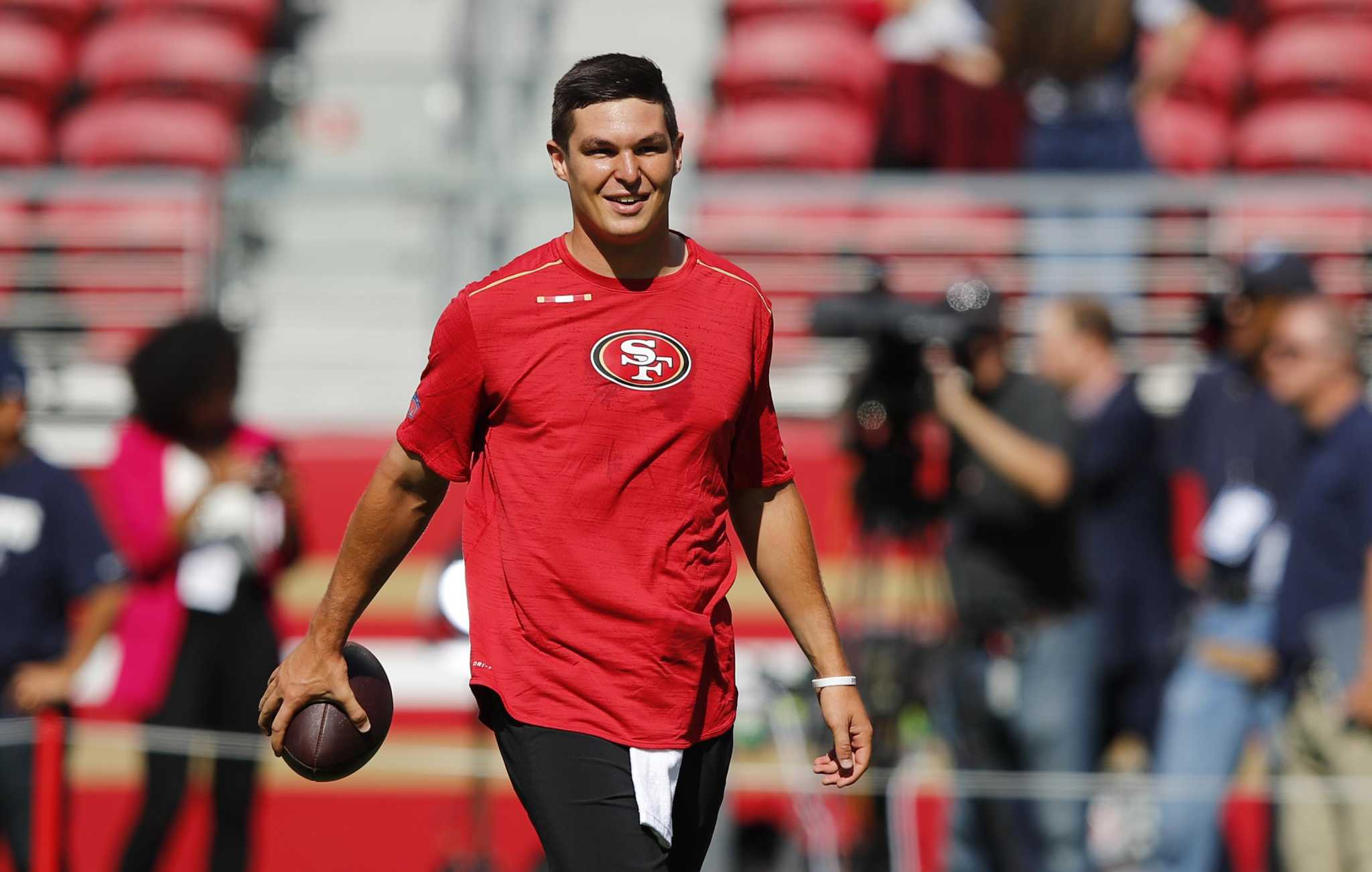 Cleveland Browns quarterback Nick Mullens (9) makes a run before throwing  the ball for a touchd …