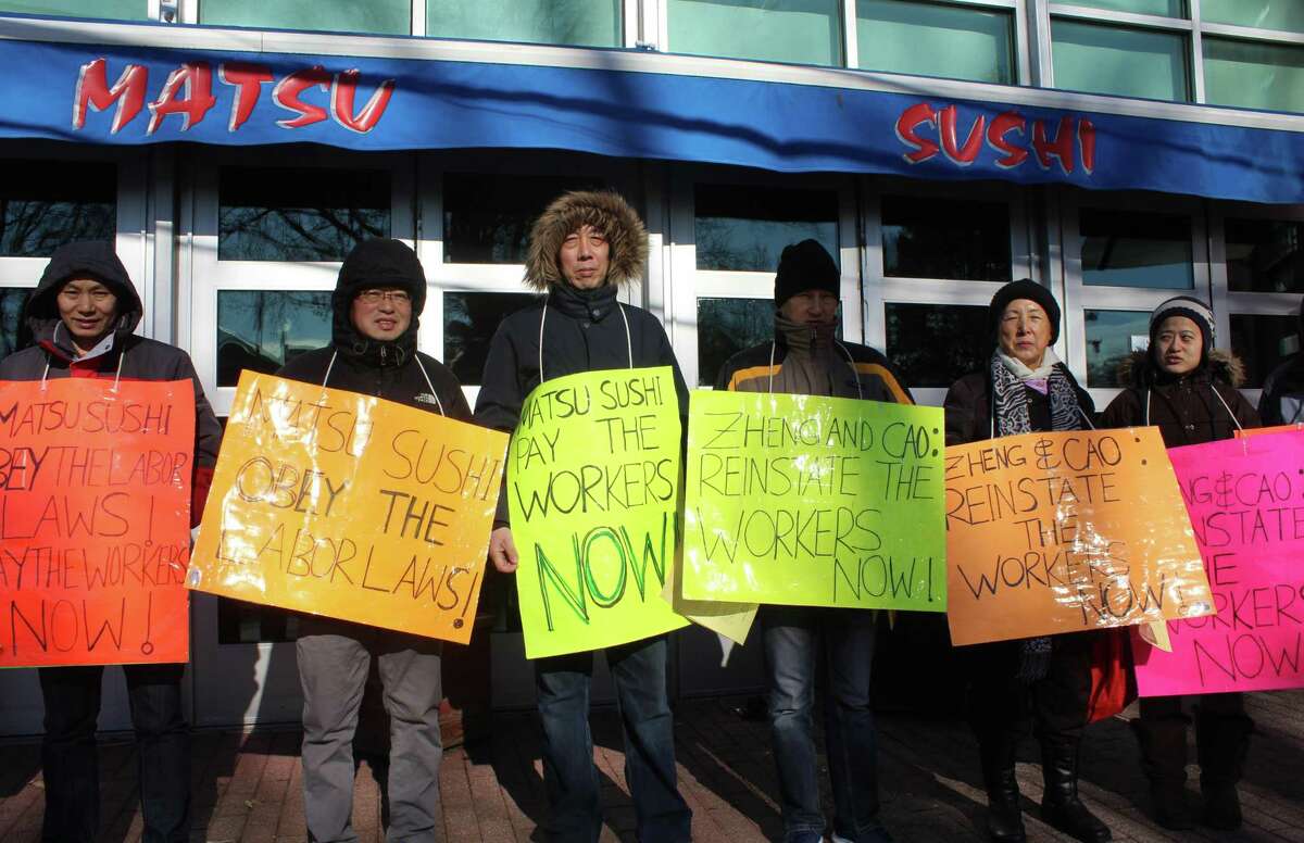 Former Matsu Sushi employees picket outside the restaurant on Jan. 14 in protest of Matsu's labor practices.