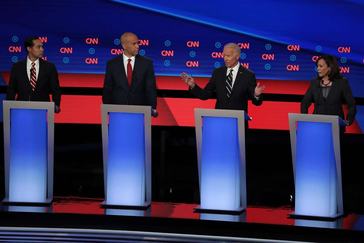 DETROIT, MICHIGAN - JULY 31: Democratic presidential candidate former Vice President Joe Biden (2nd R) speaks while Sen. Kamala Harris (D-CA) (R) and Sen. Cory Booker (D-NJ) and former housing secretary Julian Castro listen during the Democratic Presidential Debate at the Fox Theatre July 31, 2019 in Detroit, Michigan. 20 Democratic presidential candidates were split into two groups of 10 to take part in the debate sponsored by CNN held over two nights at Detroits Fox Theatre. (Photo by Scott Olson/Getty Images)