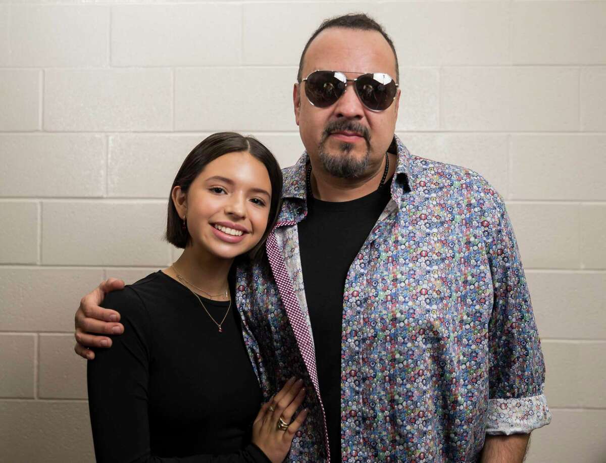 Mexican ranchera singer Pepe Aguilar, right, and his 15-year-old daughter Ángela, also a ranchera singer, pose for photos at a press conference for the Jaripeo Sin Fronteras Tour at the Toyota Center in Houston, Monday, Aug. 5, 2019. The Aguilars will perform at the Houston Jaripeo Sin Fronteras on Aug. 18.