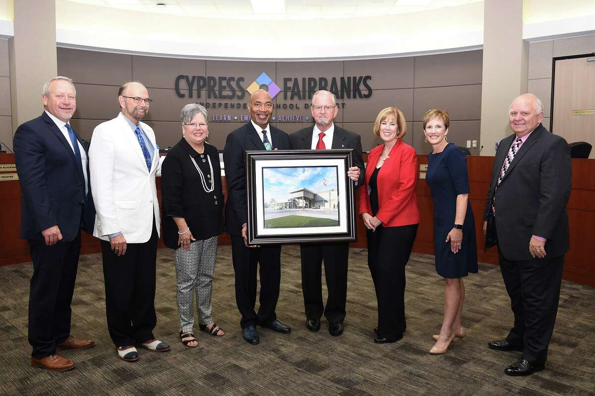 Windfern namesake: CFISD namesakes were chosen for future and existing campuses and facilities during the CFISD Board of Trustees meeting on Aug. 12. Leonard Brautigam (fourth from right), namesake for the former Windfern School of Choice, poses with Board of Trustees (from left) Don Ryan, Tom Jackson, Debbie Blackshear, Dr. John Ogletree, Darcy Mingoia, Julie Hinaman and Bob Covey.