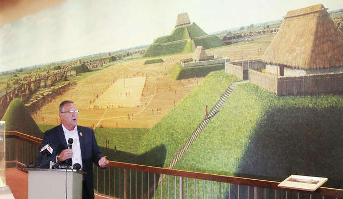 U.S. Rep. Mike Bost, R-Murphysboro, talks Tuesday morning in front of a mural depicting the ancient city of Cahokia at its height during a press conference at the Cahokia Mounds State Historic Site Interpretive Center. Bost has introduced legislation to elevate Cahokia Mounds and related local sites to national park status.