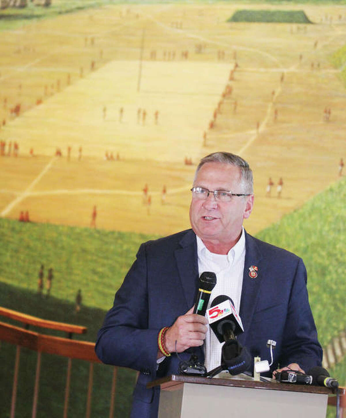 U.S. Rep. Mike Bost, R-Murphysboro, talks Tuesday in front of a mural depicting the ancient city of Cahokia at its height during a press conference at the Cahokia Mounds State Historic Site Interpretive Center. The mural depicts the city’s residents playing a game called Chunkey. Bost has introduced legislation to elevate Cahokia Mounds and related local sites to national park status.