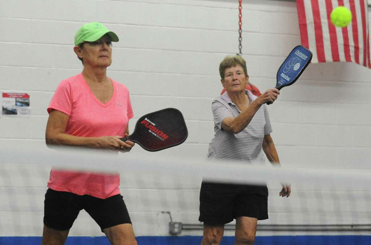 Nancy Crowley and Marge Connelly play Pickleball at the Norwalk Senior Center Wednesday, Sept. 12, 2018, in Norwalk, Conn. The center offers pickleball three times a week to allow seniors to get some exercise despite inclement weather.
