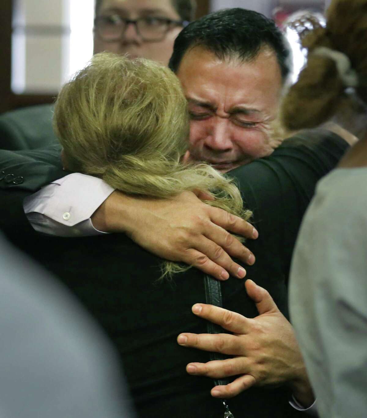 Gene Vargas, father of Jared Vargas, is embraced by neighbor Yolanda Martinez following the guilty verdict Tuesday against Ernesto Esquivel-Garcia, who killed the younger Vargas last year.