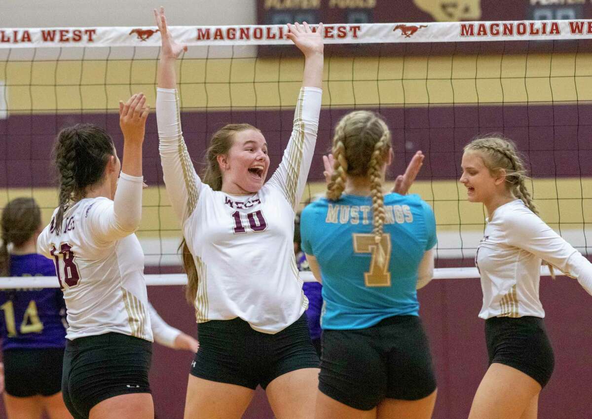 Magnolia West celebrates after scoring during a non-district volleyball match Tuesday, August 13, 2019 at Magnolia West High School in Magnolia.